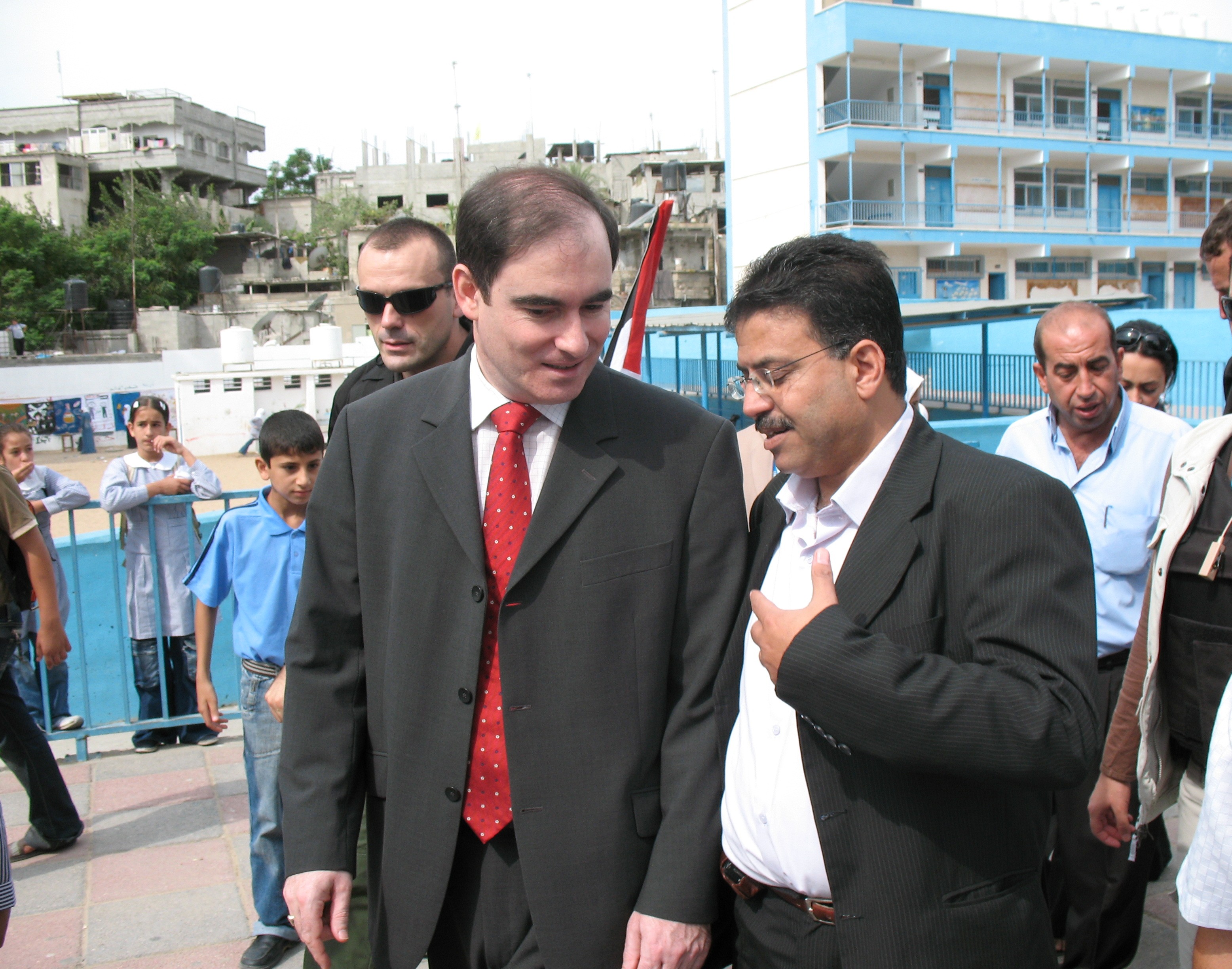 Protective personnel accompanying a delegation during a site visit